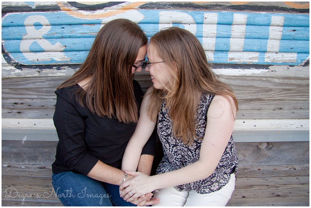 Houston same sex engagement session at Kemah Boardwalk by Degrees North Images