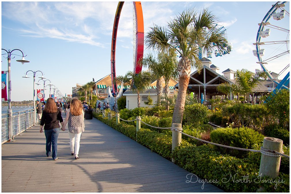 Houston same sex engagement session at Kemah Boardwalk by Degrees North Images