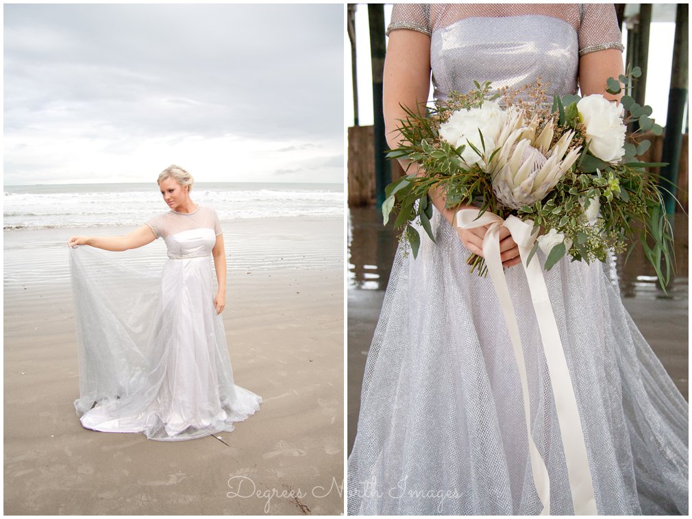 Bride in a silver wedding dress with white protea bouquet on Galveston Beach
