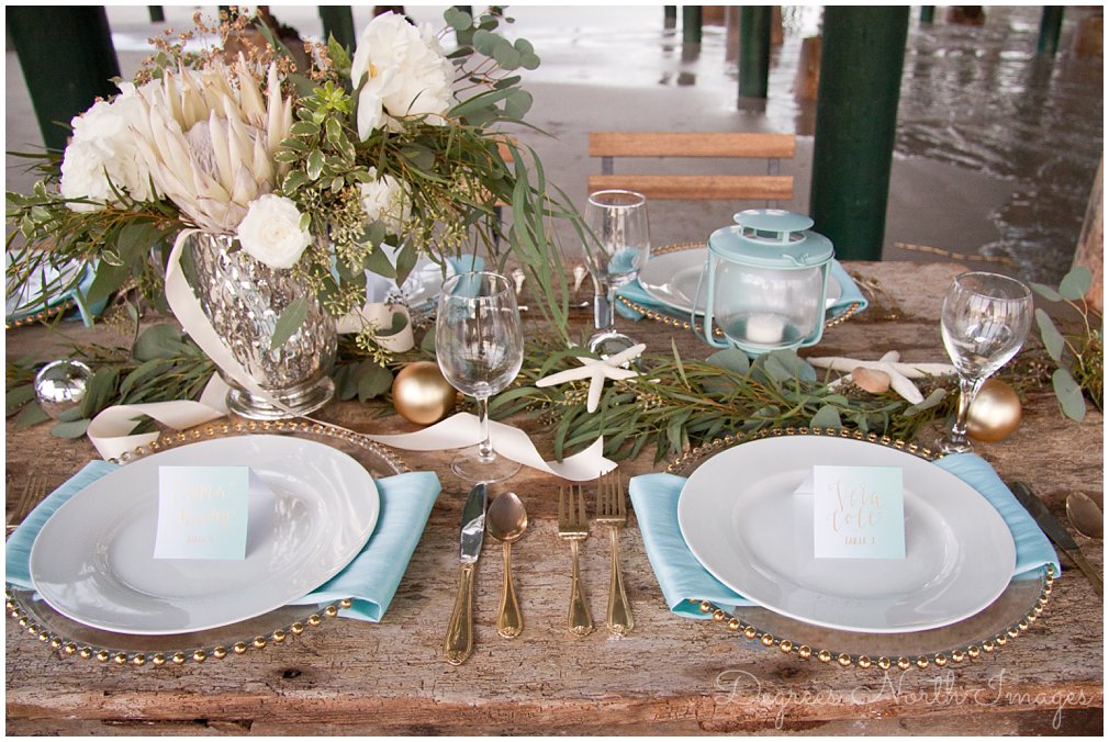 Intimate nautical Christmas wedding table with garland, starfish and ornaments