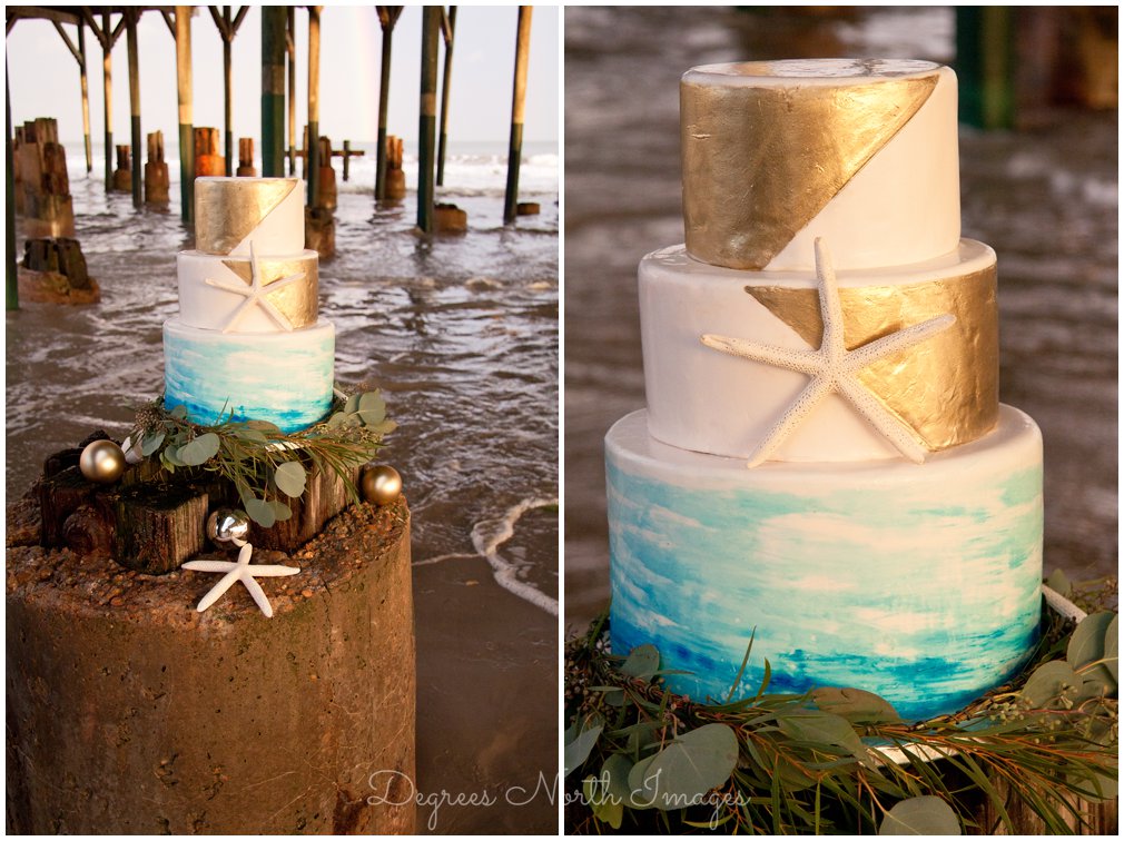 Aqua, gold and white 3-tier round wedding cake with starfish