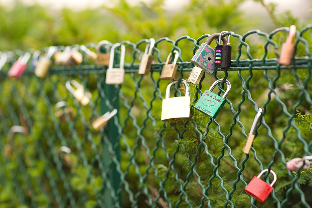 locks on a fence near the Eiffel Tower