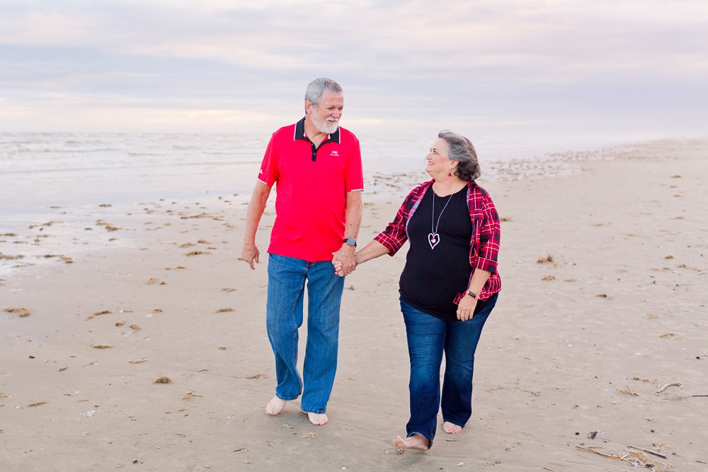 grandparents walking on the beach in Galveston, Texas