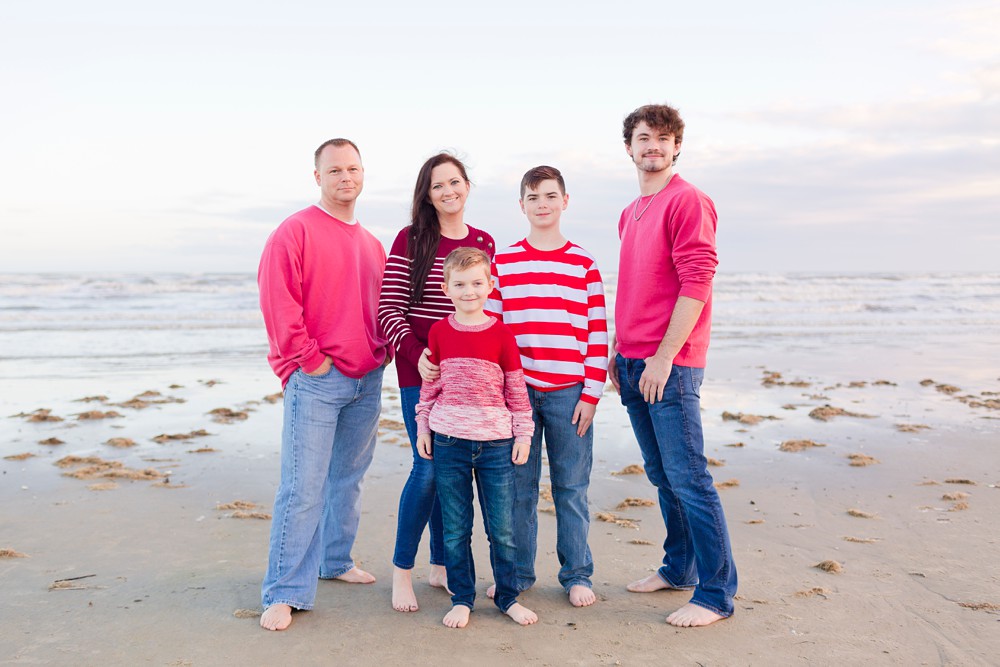 Mom and dad with kids at Galveston beach family session