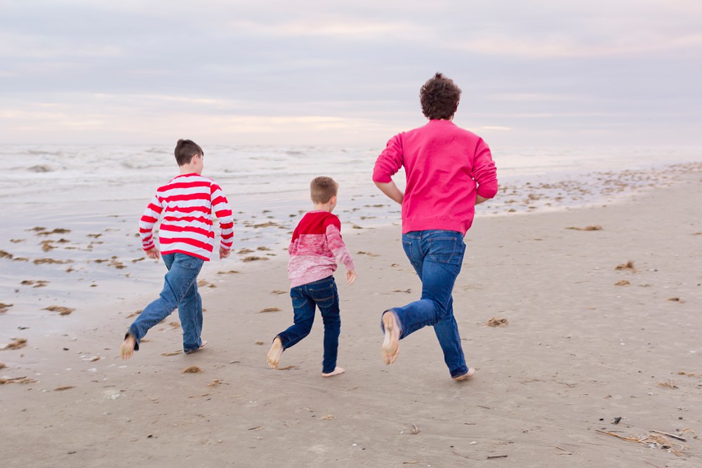 kids running down the beach in Galveston, Texas