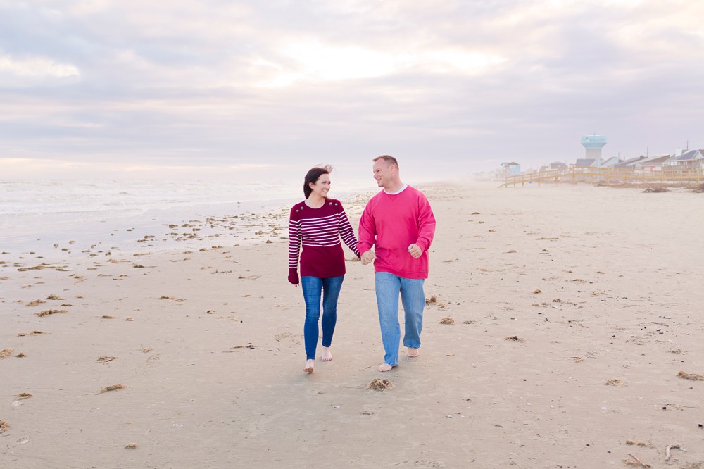 couple walking along Sea Isle Beach in Galveston