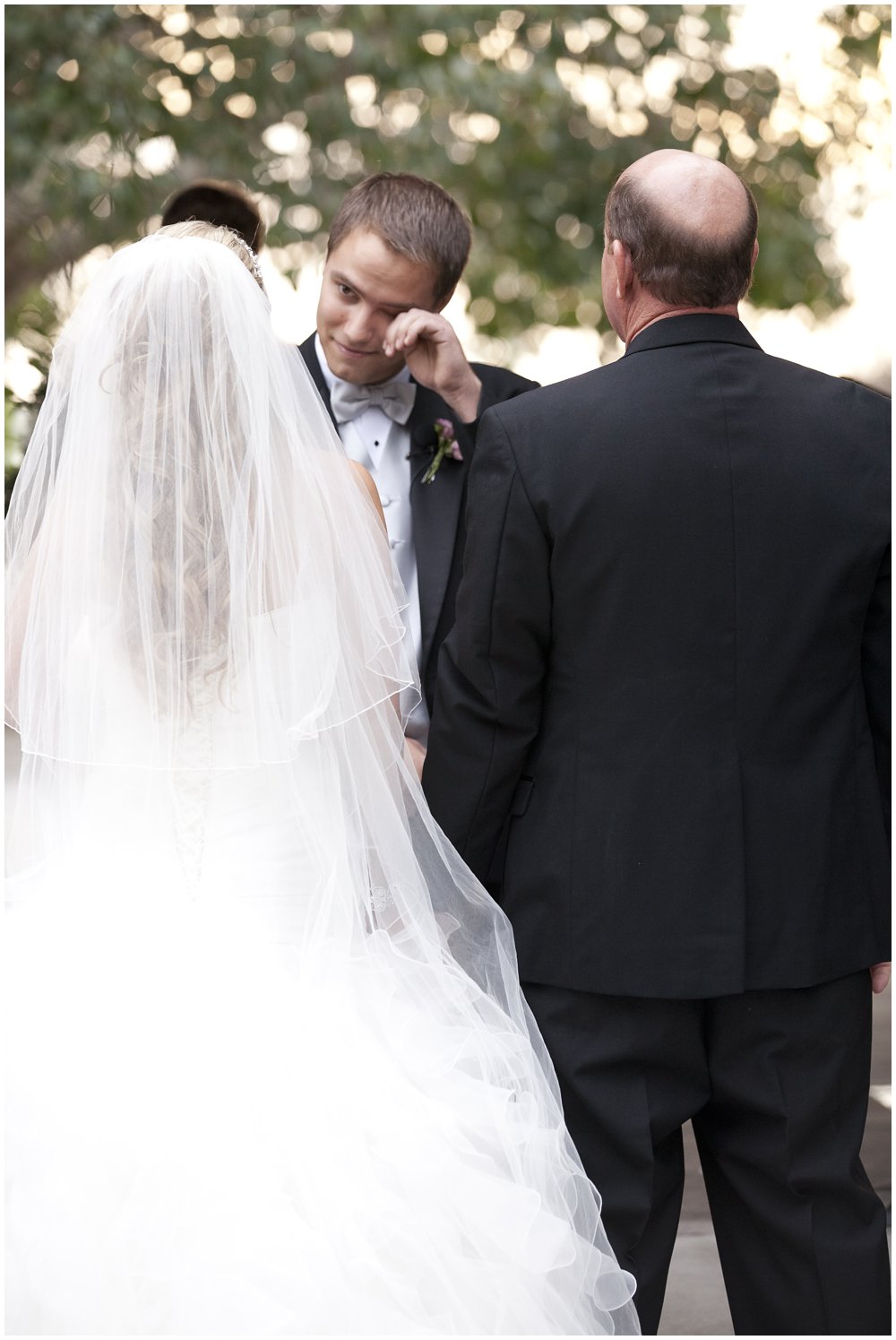 groom crying at bride enters wedding ceremony at Schimmel Wedding Pavilion at Marie Selby Botanical Garden