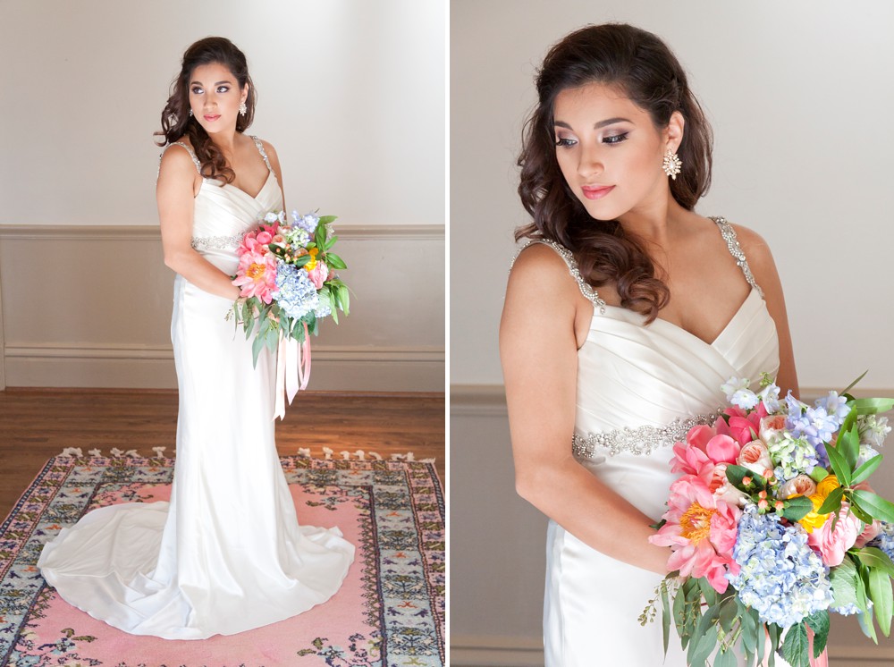 Bride in satin sheath dress with pink and blue bridal bouquet