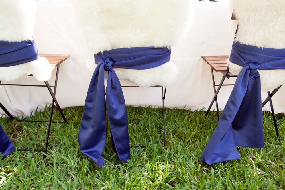 fur chair covers with blue satin sashes