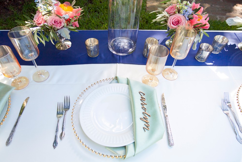 place setting with aqua napkin and laser cut place card