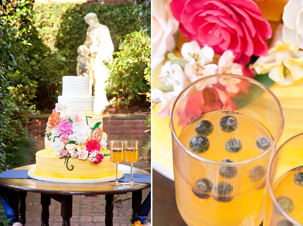 Yellow ombre wedding cake with orange, pink, fuchsia and white sugar flowers