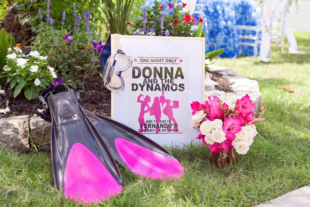 Mamma Mia wedding decorations including Donna and the Dynamos sign, scuba fins and scuba mask