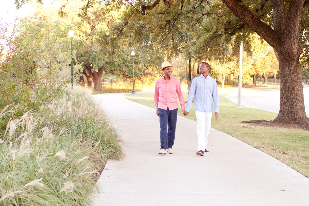 Gay couple at engagement session in Hermann Park
