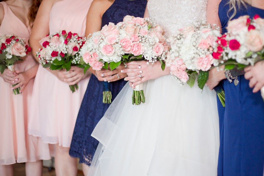 Bride with pink and white bouquet and bridesmaids with fuchsia and white bouquets 
