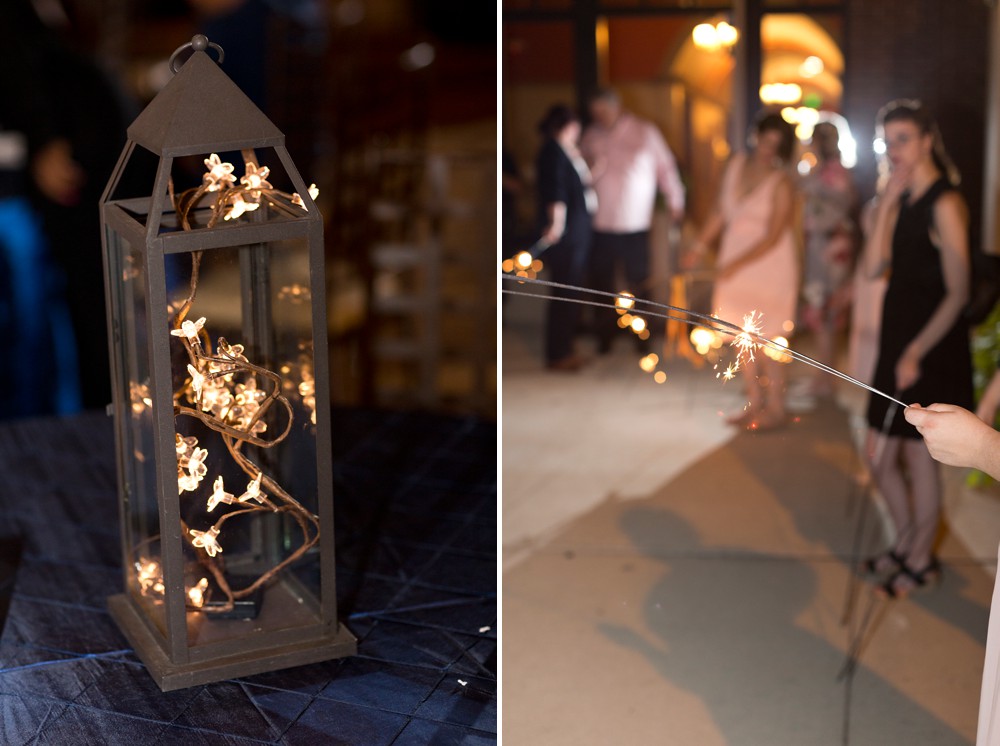Iron lantern centerpiece with floral lights at modern wedding at Noah's, sparkler exit