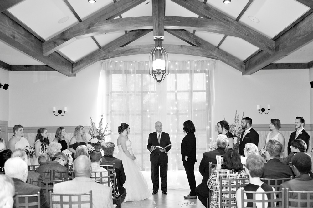 Brides exchanging vows in the ceremony room at Noah's Event Venue 