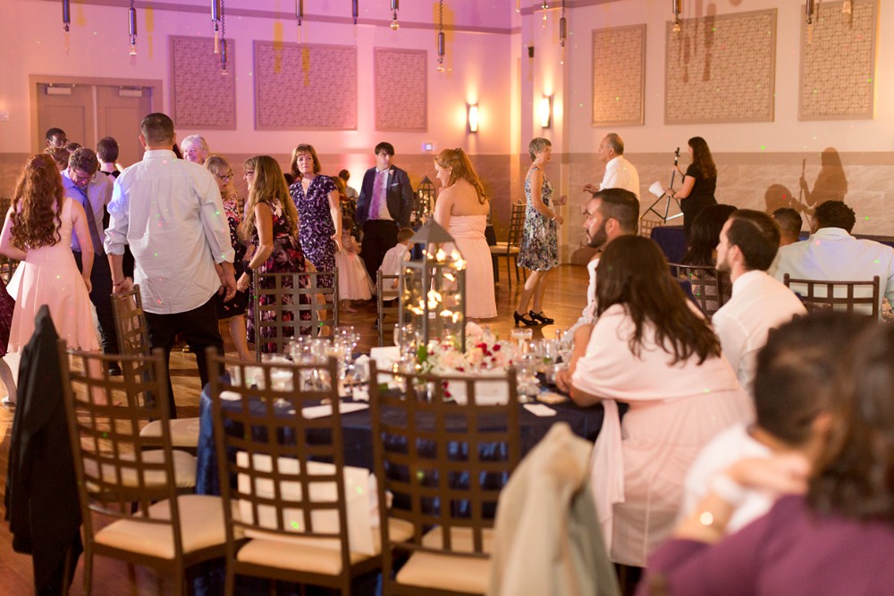 Modern wedding at Noah's Event Venue reception with pink accent lighting