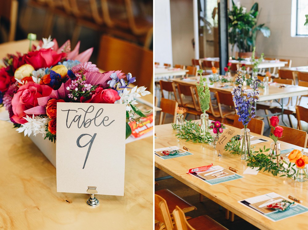 Floral centerpieces on rectangle wood tables at Paikka
