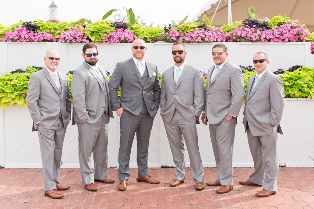 Groom and groomsmen in sunglasses near the Promenade Deck at Mission Point Resort