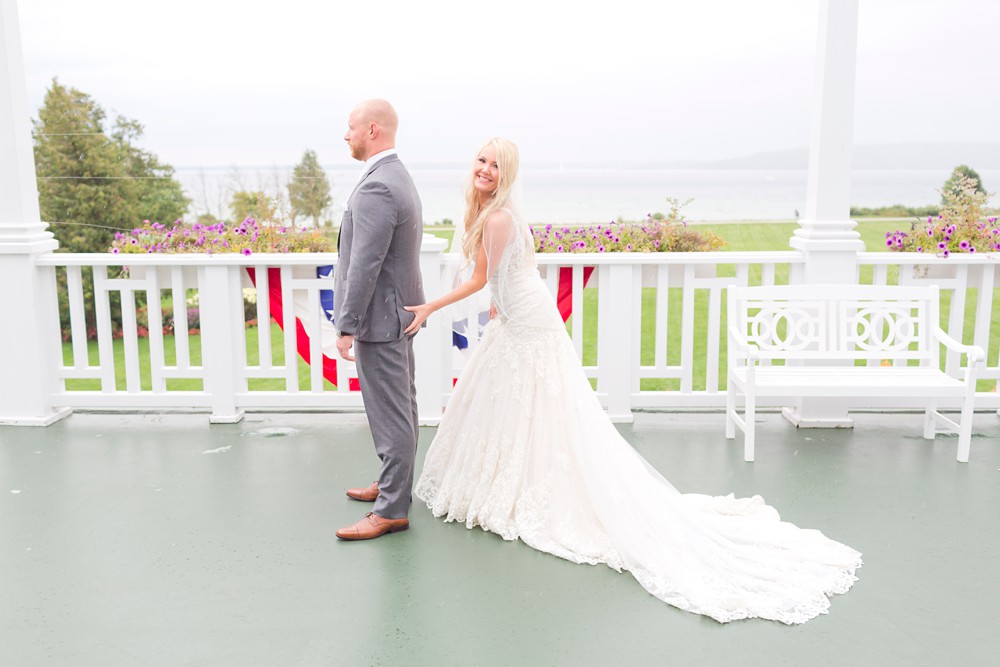 Bride grabs groom's butt at first look at Mission Point Resort wedding