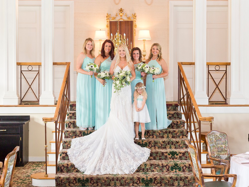 Bride with Bridesmaids on stairs inside Mission Point Resort
