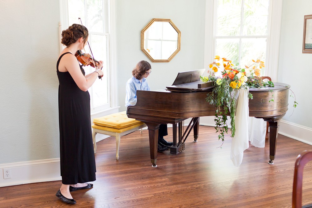 Pianist and violinist playing at Carr Mansion wedding