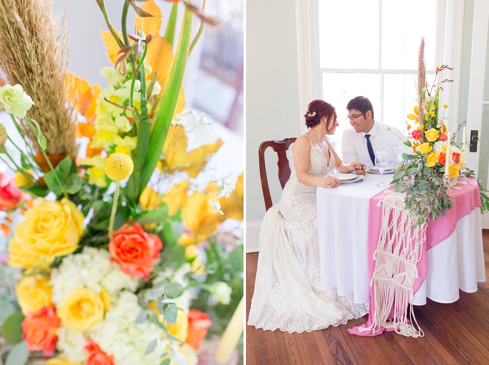 Bride and groom sweetheart table with yellow and orange wedding centerpiece 