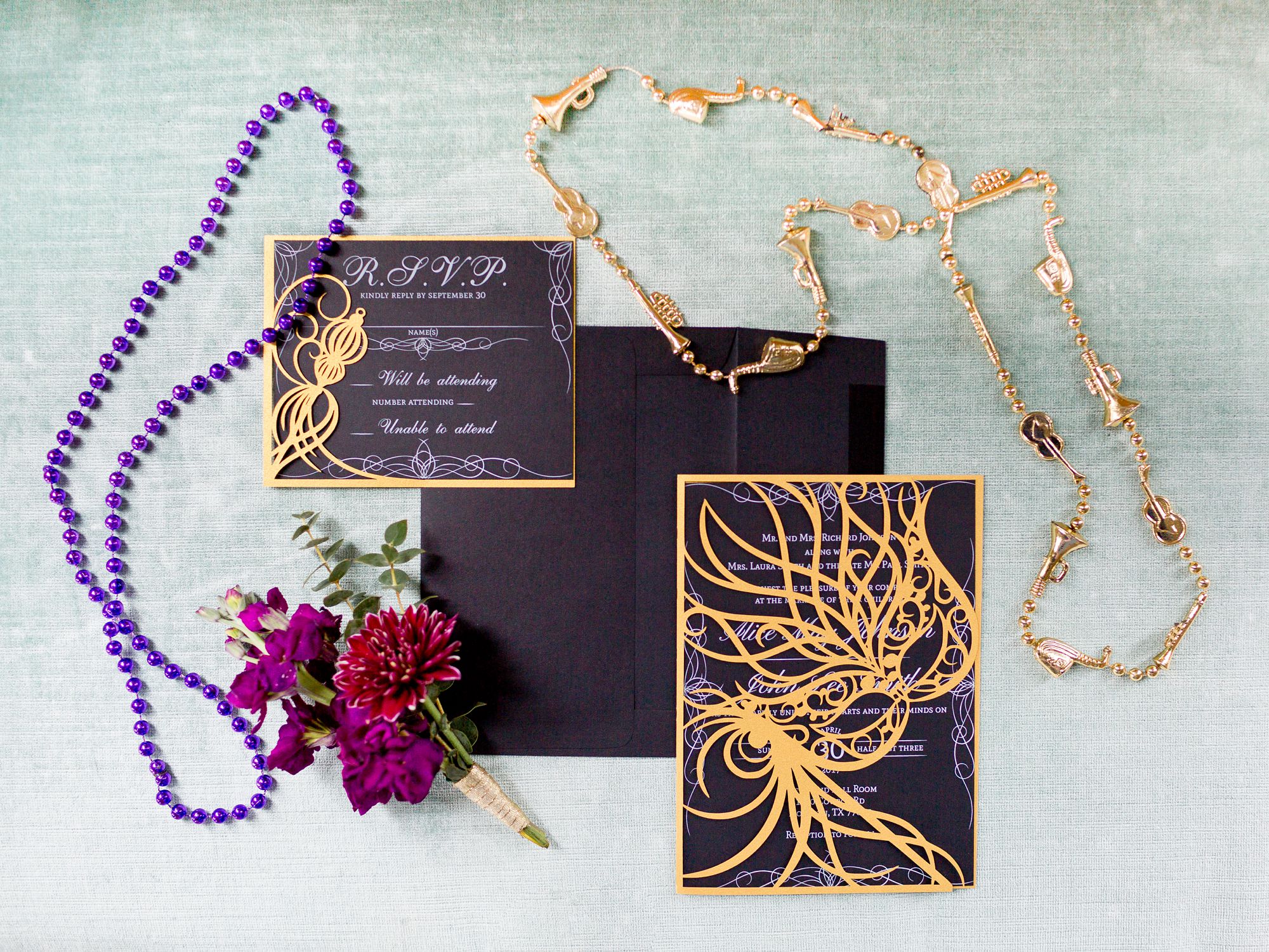 Mardi Gras inspired elopement invitations in black and gold