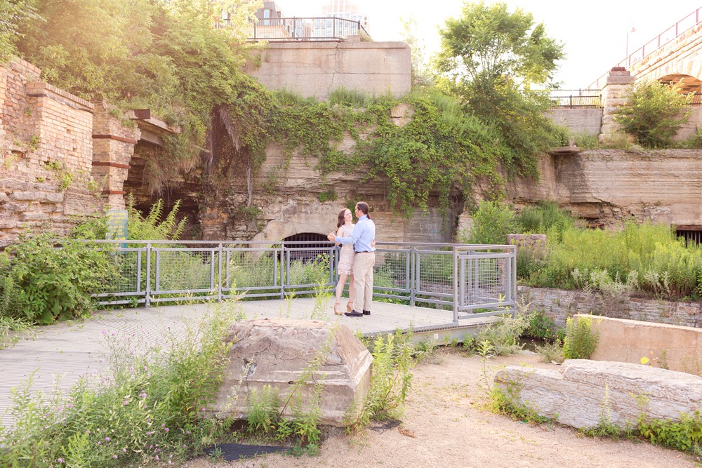 Couple dancing during their anniversary session at Mill Ruins Park in Minneapolis