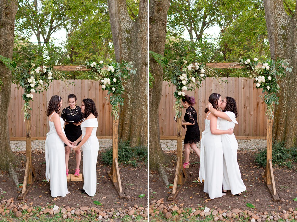 Brides exchanging first kiss at their backyard wedding ceremony