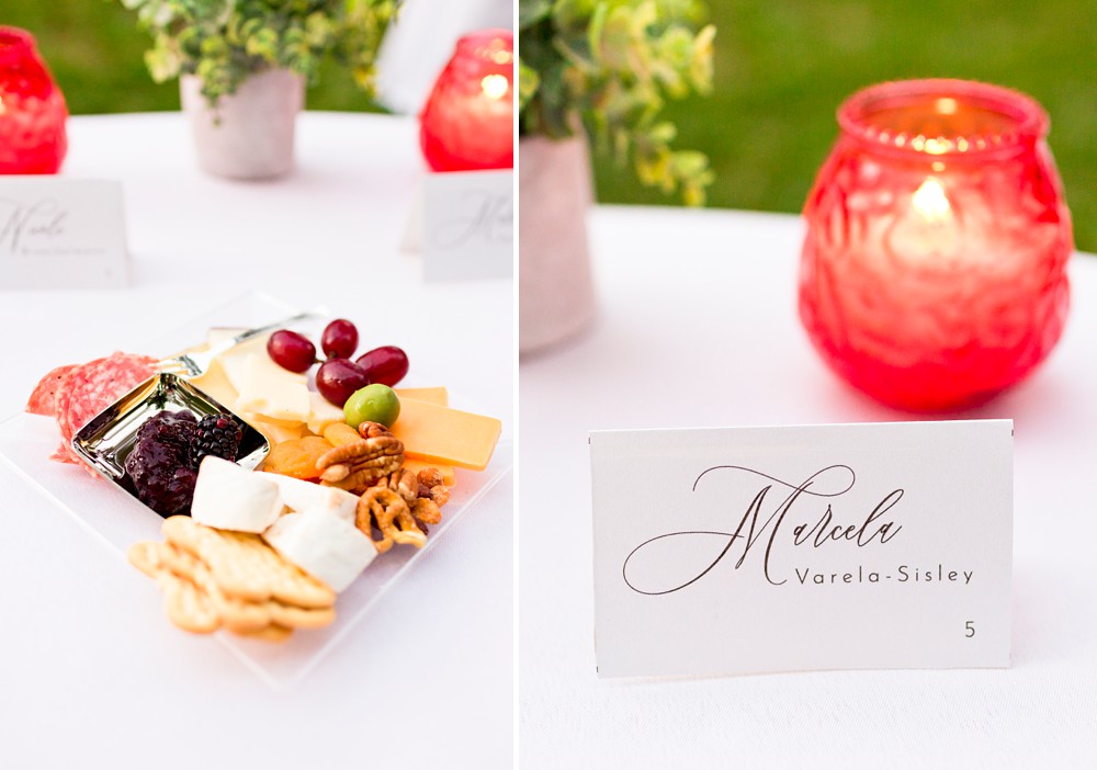 Place card and charcuterie plate on sweetheart table at backyard wedding