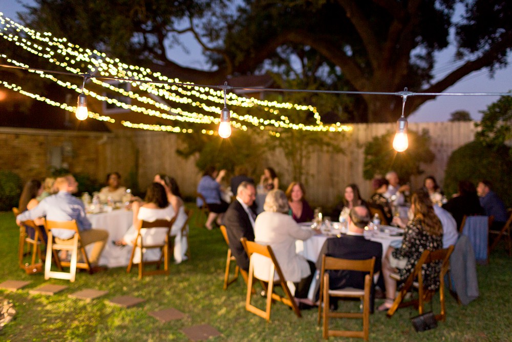 Backyard wedding with string lights