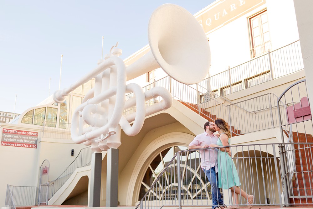 Couple in front of The Stone Trumpet sculpture at Old Galveston Square