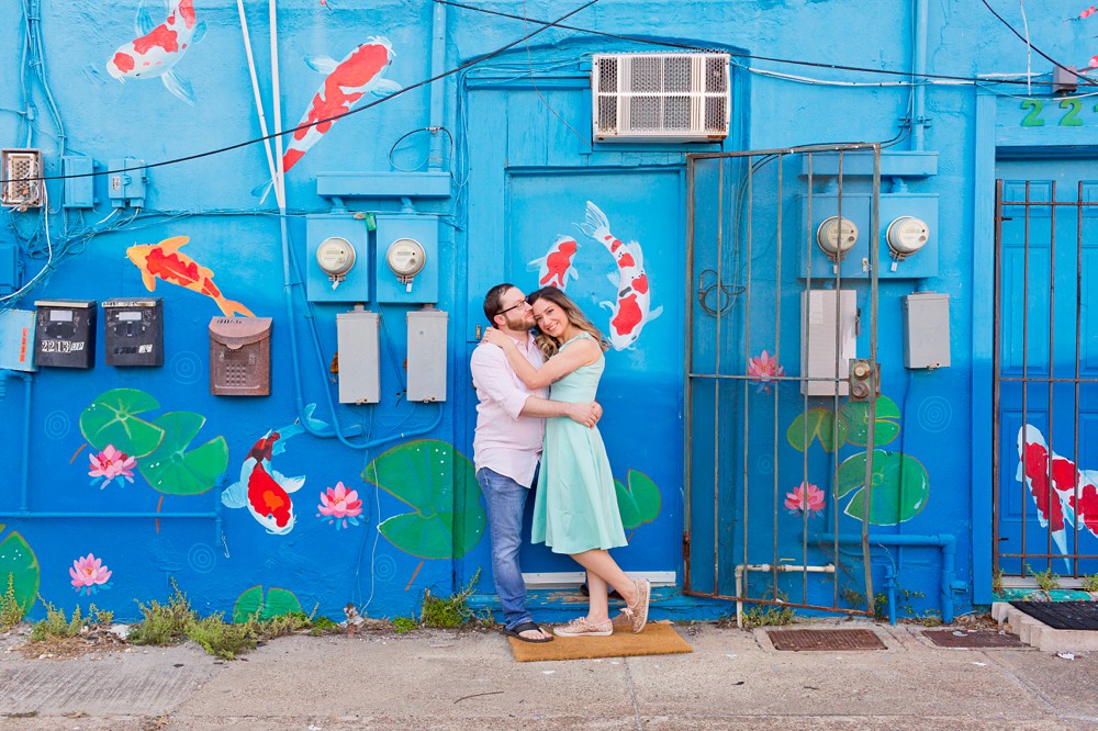 Couple in front of the Koi Pond Mural at their Galveston historic district engagement session