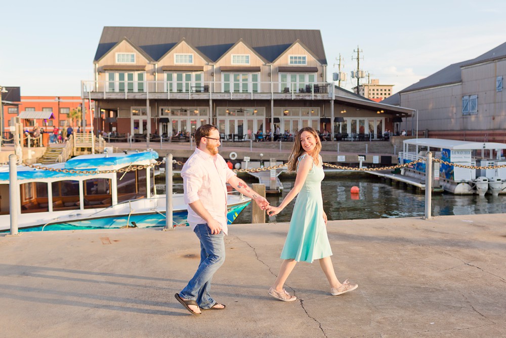Couple walking together at Pier 21 in Galveston