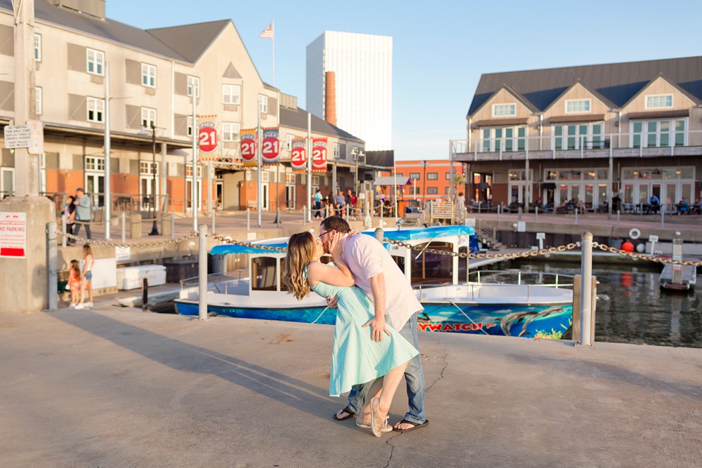 Couple dancing together on Pier 21 at their Galveston historic district engagement session