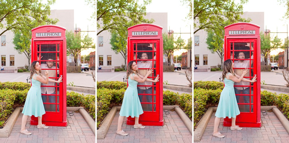 Couple playing in the telephone booth at Saengerfest Park in Galveston