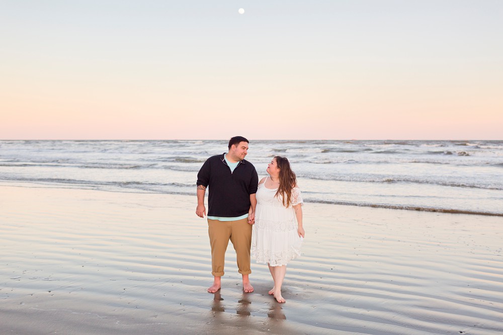 Couple at their Galveston Beach sunset engagement session