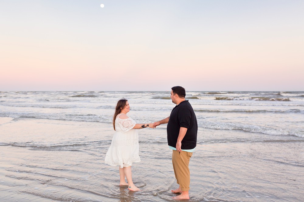 Couple at their Galveston Beach sunset engagement session