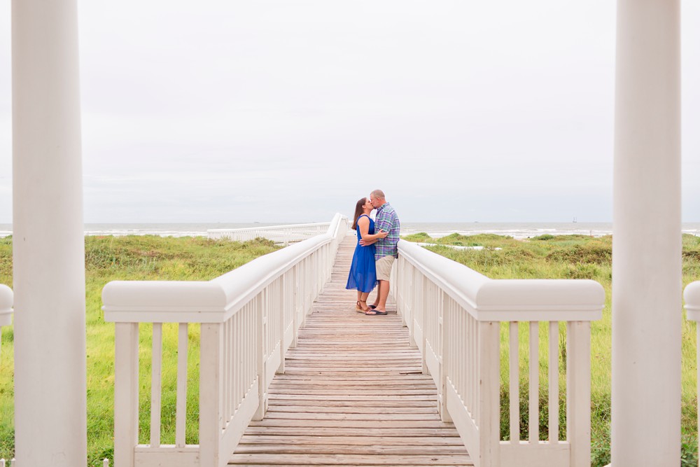 Couple on dune walkover in Beach Town on Galveston Island