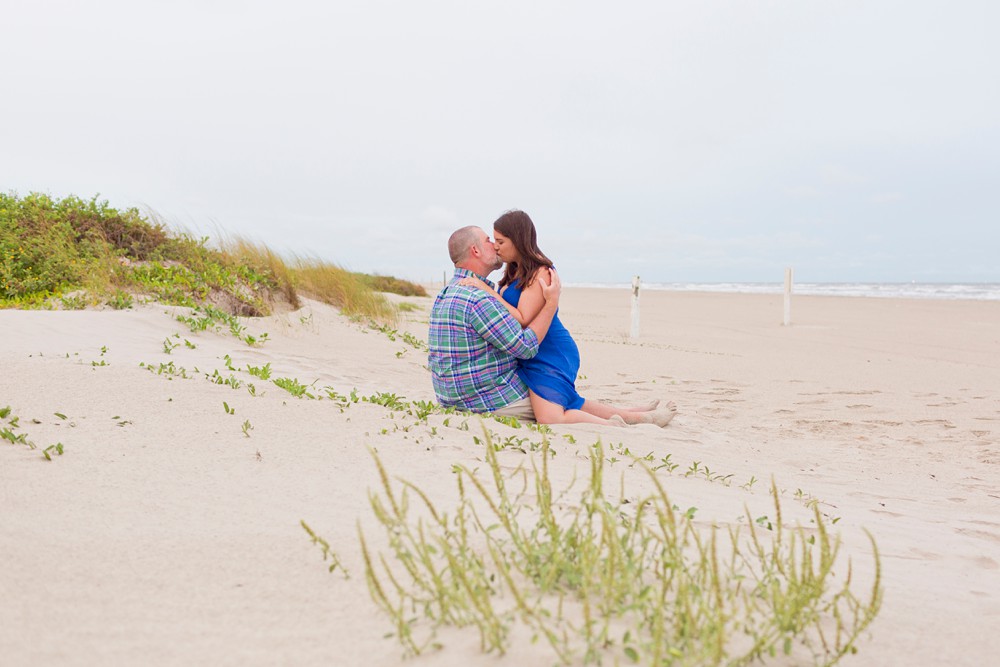 Couple kissing on the beach in Galveston Texas