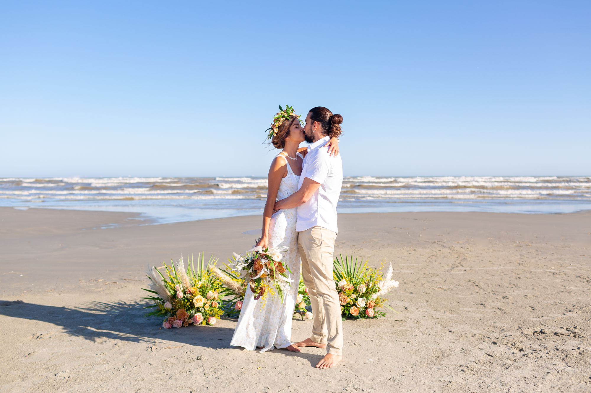 Bride and groom at wedding ceremony on Galveston Beach