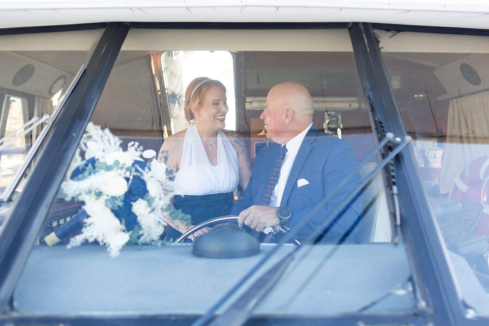 A bride and groom share a quiet moment on a yacht in Kemah, Texas.