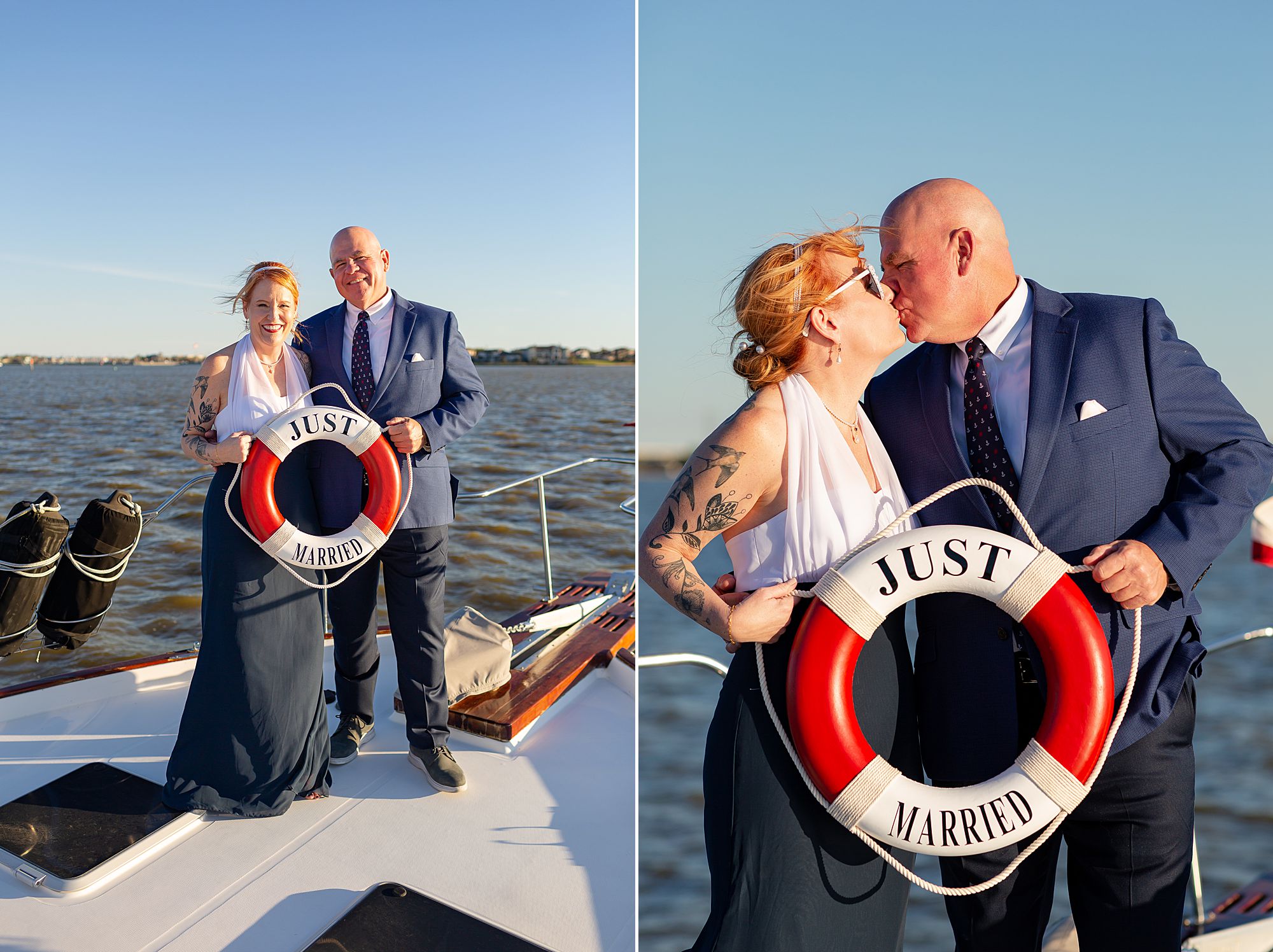 A bride and groom pose with a red and white life ring that says just married, on the bow of a boat with a lake in the background.